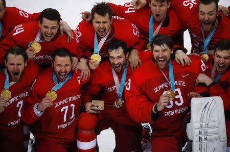 Ice Hockey - Pyeongchang 2018 Winter Olympics - Men's Final Game - Olympic Athletes from Russia v Germany - Gangneung Hockey Centre, Gangneung, South Korea - February 25, 2018 - Olympic Athletes from Russia pose with their gold medals. REUTERS/Brian Snyder
