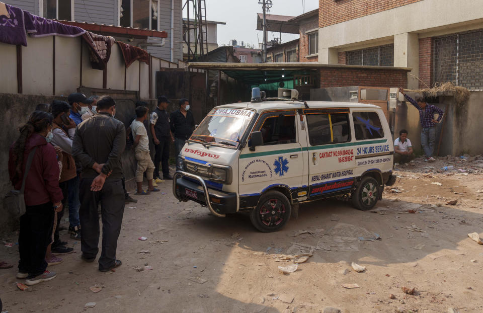 An ambulance carrying the dead body of Irish climber Noel Richmond, 56, brought from Annapurna mountain region is seen in Kathmandu, Nepal, Tuesday, April 18, 2023. An Irish climber died and an Indian is missing after falling into a crevasse in two separate incidents on Mount Annapurna, the world's 10th highest mountain, an expedition organizer said Tuesday. (AP Photo/Niranjan Shrestha)