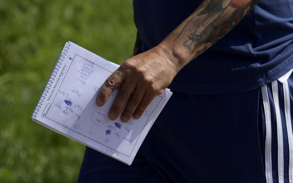 Argentina coach Jorge Sampaoli was pictured holding a notebook detailing his training session - AFP