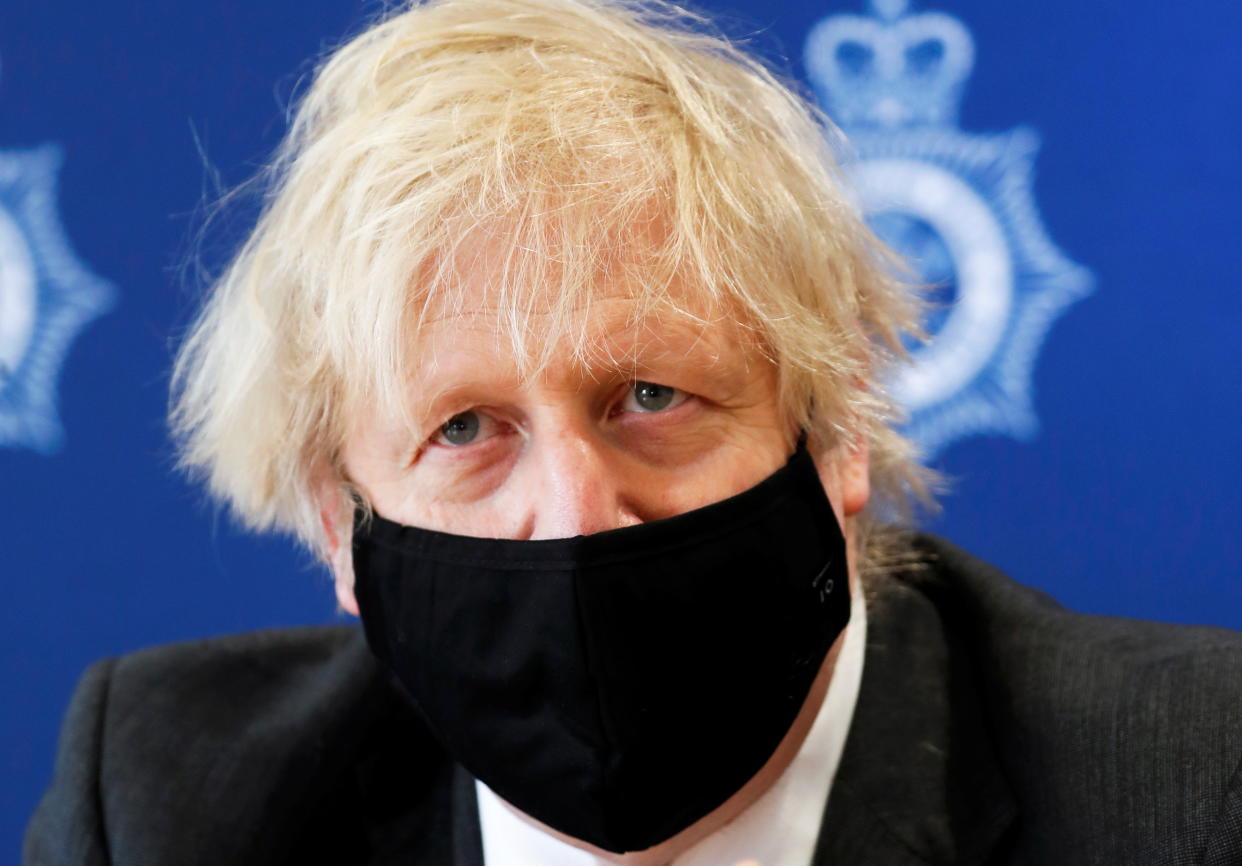 Britain's Prime Minister Boris Johnson visits South Wales Police Headquarters in Bridgend, South Wales, Britain February 17, 2021. Alastair Grant/Pool via REUTERS