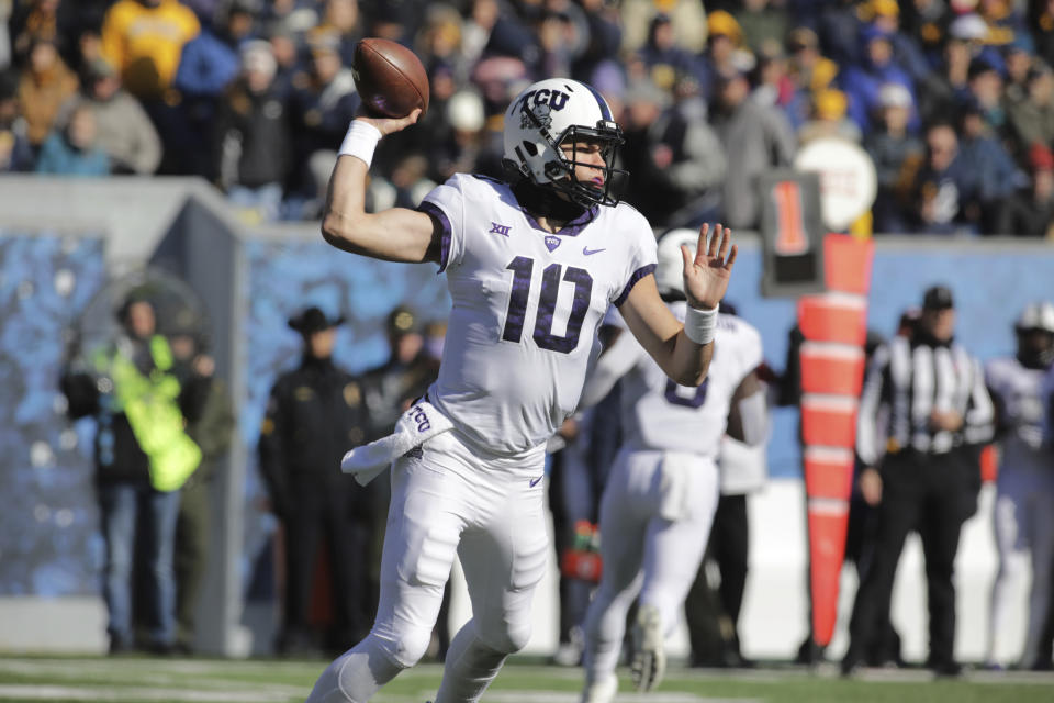 TCU quarterback Michael Collins (10) attempts a pass during the first half of an NCAA college football game against West Virginia, Saturday, Nov. 10, 2018, in Morgantown, W.Va. (AP Photo/Raymond Thompson)
