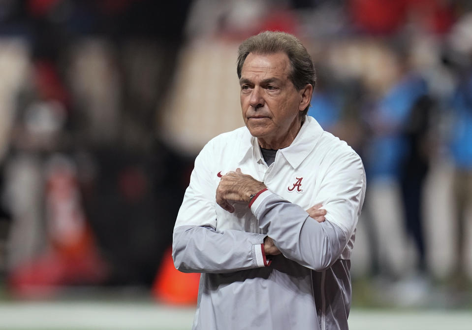 FILE - Alabama coach Nick Saban watches players warm up for the team's College Football Playoff championship game against Georgia on Jan. 10, 2022, in Indianapolis. The first year of the athlete compensation era in college sports evolved into almost everything the NCAA didn't want when it gave the green light last summer.v“When you see Nick Saban losing his cool over recruiting, it's a sure sign that damage is being done at the highest levels of NCAA athletic competition,” University of Illinois labor law professor Michael LeRoy said, referring to the Alabama football coach's comments in May. (AP Photo/Paul Sancya, File)