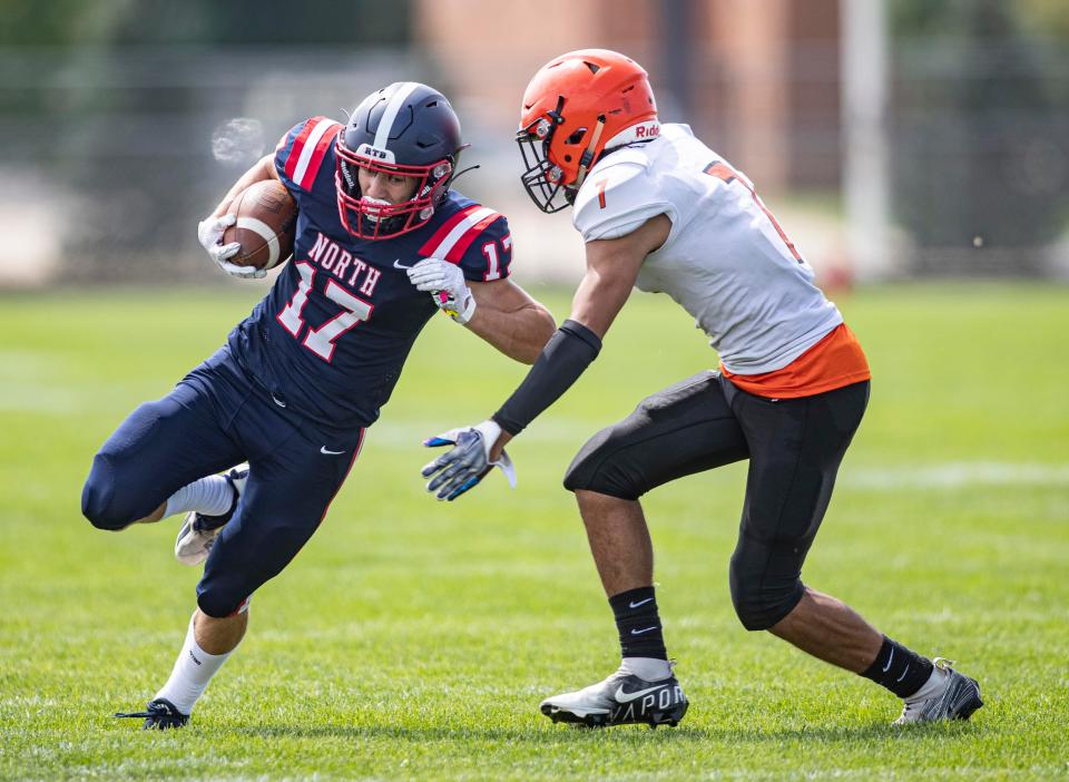 Belvidere North's Nico Bertolino tries to run past Freeport's Dedric Macon on Aug. 27, 2022, at Belvidere North High School in Belvidere. Bertolino needs 42 yards to be the 31st NIC-10 runner to top 2,000 for his career and has averaged a record 9.65 yards per carry.