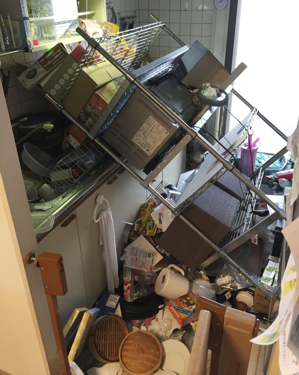 <p>Scattered objects lie in the kitchen of a damaged house in Osaka, following an earthquake Monday, June 18, 2018. A strong earthquake has shaken the city of Osaka in western Japan. There are reports of scattered damage including broken glass and concrete. (Photo: Kyodo News via AP) </p>