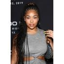 Jordyn Woods fêted Justin Roberts's New Music Video 'Way Too Much' with a set of box braids that were left loose and wavy at the ends. Offering proof that scrunchies are making a big comeback, the model used a satiny-looking animal-print version to hold her braids in a half-up, half-down look.