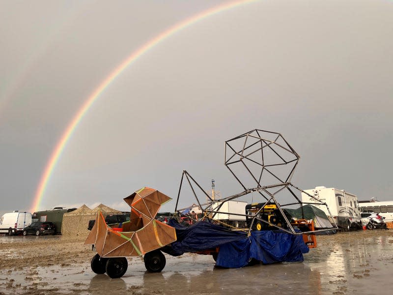 A rainbow and the muddied grounds at Burning Man in Nevada in September 2023.