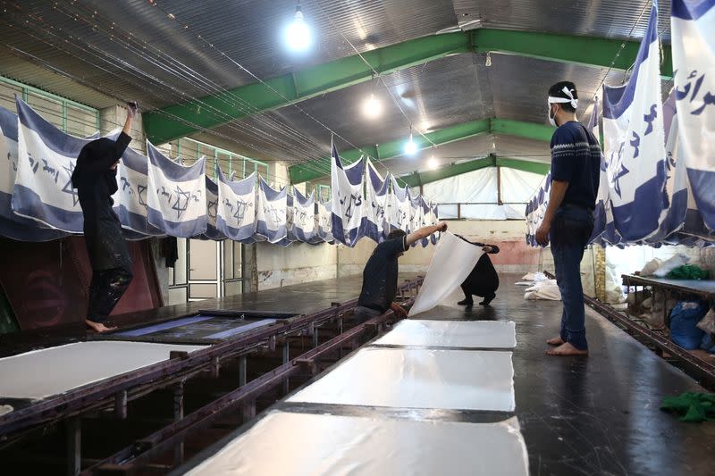 Large flag factory creates U.S. and Israeli flags for Iranian protesters to burn in Khomein City