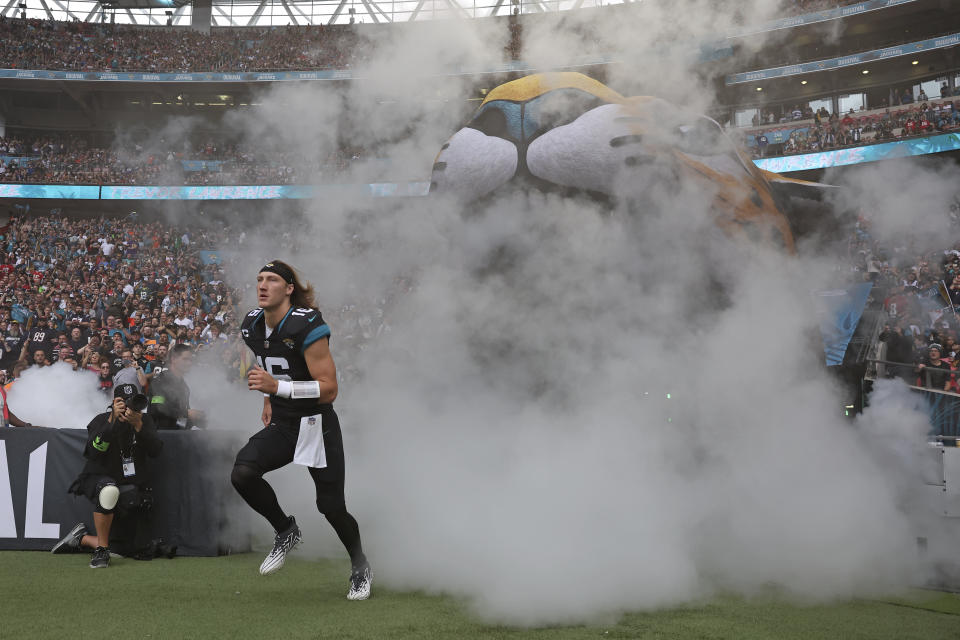 Jacksonville Jaguars quarterback Trevor Lawrence (16) runs onto the field for an NFL football game between the Atlanta Falcons and the Jacksonville Jaguars at Wembley stadium in London, Sunday, Oct. 1, 2023. (AP Photo/Ian Walton)