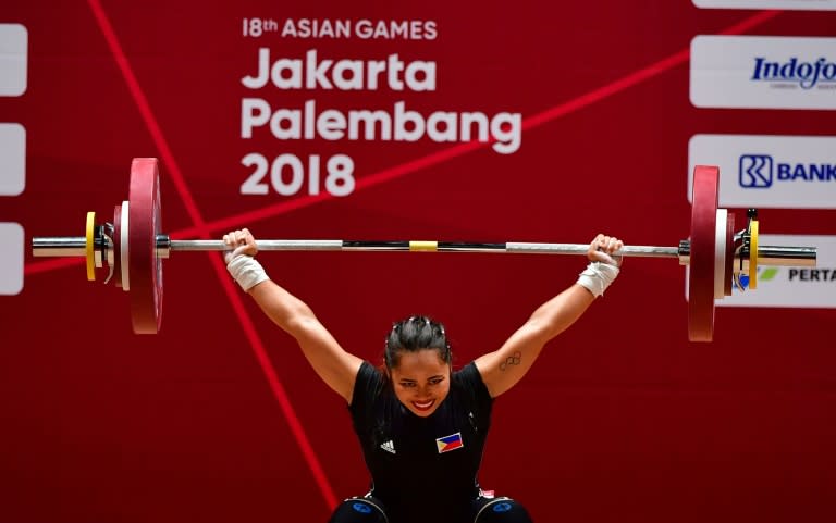 Hidilyn Diaz of Philippines competes in the women's 53kg weightlifting event during the 2018 Asian Games in Jakarta on August 21, 2018