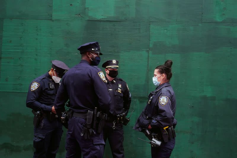 FILE PHOTO: Police officers stand in Times Square in New York City