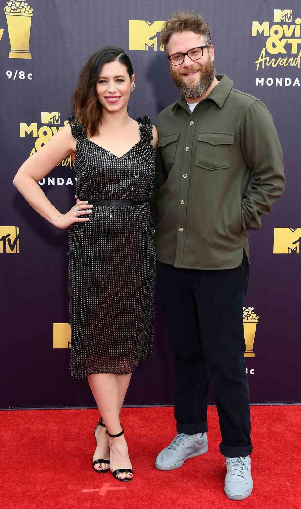 Seth Rogen (R) and Lauren Miller attend the 2018 MTV Movie And TV Awards at Barker Hangar on June 16, 2018 in Santa Monica, California