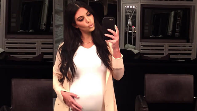 Kim Kardashian is glowing while her baby bump is growing! The pregnant reality star posted an adorable Instagram picture of herself gently touching her burgeoning belly while sporting a tight white dress on Monday. <strong> PHOTOS: Kim Kardashian's Second Pregnancy Styles </strong> "Good night baby," Kim captioned the sweet snap. Last month, the 34-year-old soon-to-be mother of two spoke to ET about how this pregnancy is different from her first with daughter North West, 2. <strong> MORE: North West Takes After Kim Kardashian </strong> "I want to wear things that make me feel good about myself and still feel sexy," Kim, who is expecting a boy, said. "Just because you're pregnant doesn't mean you can't wear heels and you have to wear sweats all day long. I like to still feel like myself." Kim and her husband, Kanye West, first revealed they were expecting during a promo that ran at the end of the mid-season finale of <em>Keeping Up With the Kardashians</em>. Check out 10 more celebrity baby bumps we've been keeping an eye on this summer in the video below. 