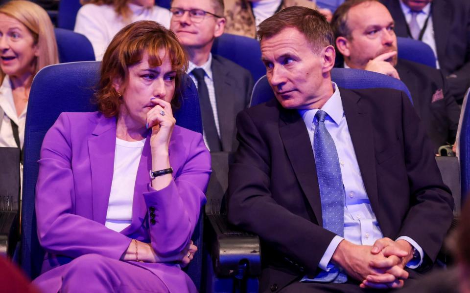 Jeremy Hunt, pictured with Victoria Atkins, the shadow health secretary, called on the Office for Budget Responsibility to intervene