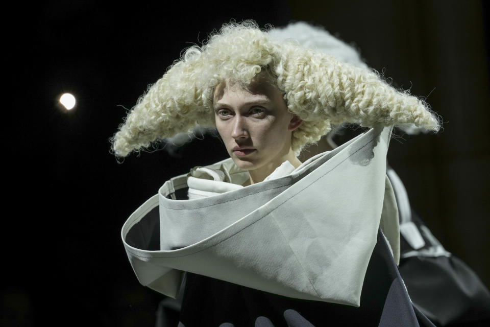 A model wears a creation as part of the Comme des Garcons Fall/Winter 2023-2024 ready-to-wear collection presented Saturday, March 4, 2023 in Paris. (Scott Garfitt/Invision/AP)