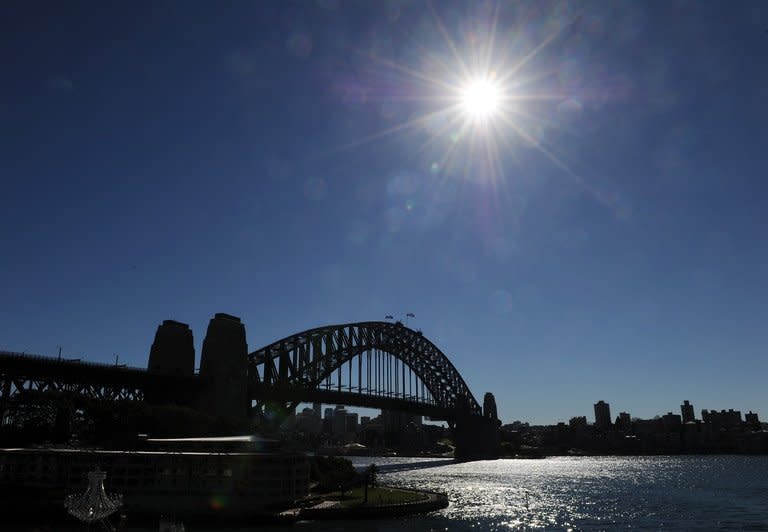 File photo shows cloudless blue skies above the Sydney Harbour Bridge on May 22, 2012. Temperatures in Sydney on Friday hit their highest levels since records began 150 years ago, after an Australian government agency warned of more frequent and intense heatwaves in the future