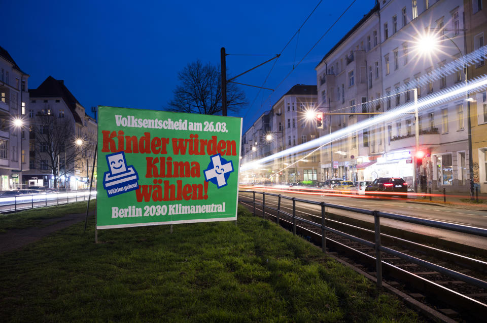 A poster reading: ""Referendum March 26. - Children would vote climate - Berlin 2030 Climate Neutral." stands out along a street in Berlin, Tuesday, March 21, 2023. Voters in Berlin go to the polls this weekend to decide on a proposal that would force the city government to drastically ramp up the German capital’s climate goals. Sunday's referendum, which has attracted considerable financial support from U.S.-based philanthropists, calls for Berlin to become climate neutral by 2030, meaning that within less than eight years the city would not be allowed to contribute further to global warming. (AP Photo/Markus Schreiber)