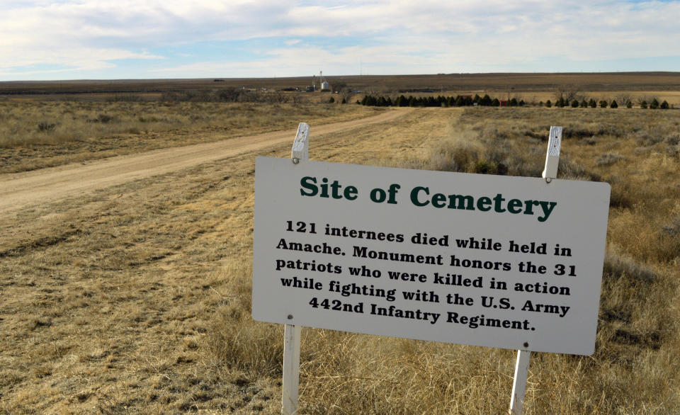 FILE - A sign points the way to the cemetery of Camp Amache, on Jan. 18, 2015, the site of a former World War II-era Japanese-American internment camp, in Granada, Colo. On the eve of the 80th anniversary of the forced internment of 120,000 Japanese-Americans at the onset of World war II, Republican U.S. Sen. Mike Lee of Utah is getting backlash for holding up the creation of a national historic site at the former internment camp in extreme southeast Colorado. (AP Photo/Russell Contreras, File)