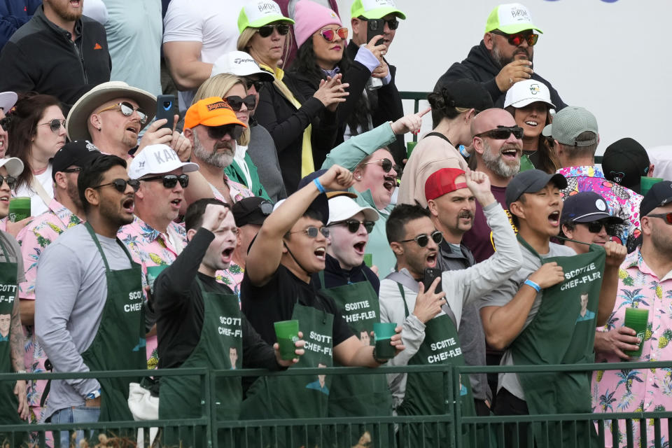 Fans of Scottie Scheffler cheer him on at the 16th hole during the second round of the Phoenix Open golf tournament Friday, Feb. 9, 2024, in Scottsdale, Ariz. (AP Photo/Ross D. Franklin)