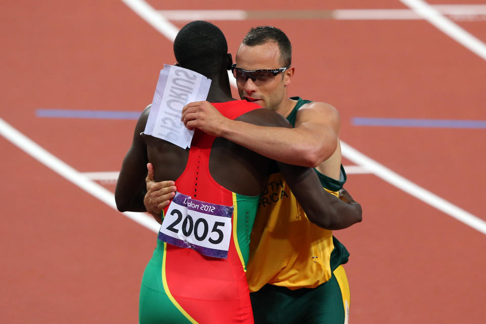 LONDON, ENGLAND - AUGUST 05: Oscar Pistorius of South Africa hugs Kirani James of Grenada after he competed in the Men's 400m Semi Final on Day 9 of the London 2012 Olympic Games at the Olympic Stadium on August 5, 2012 in London, England. (Photo by Alex Livesey/Getty Images)