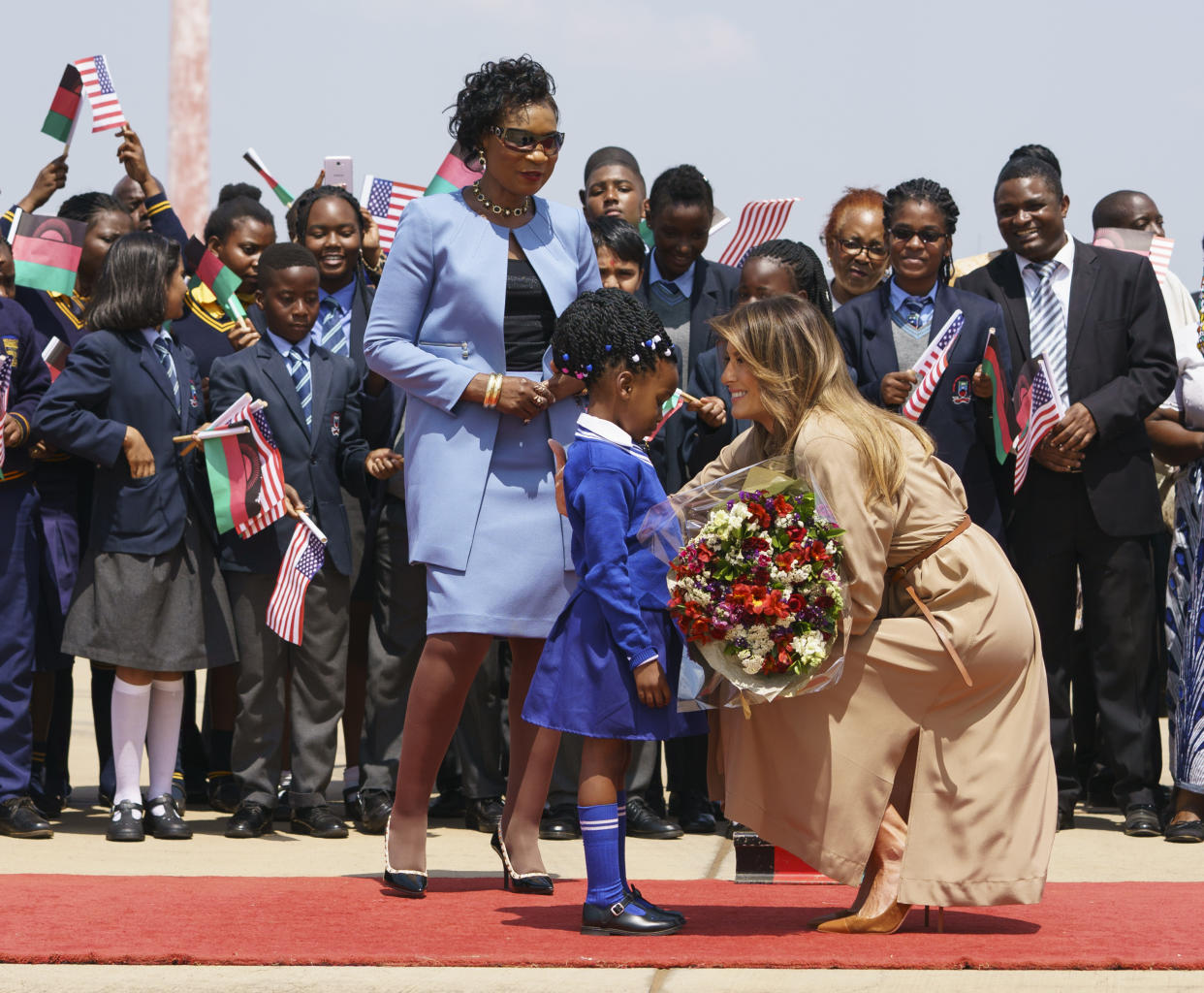 Melania Trump was greeted by a young girl and Gertrude Maseko, the first lady of Malawi, upon her arrival Thursday. (Photo: Carolyn Kaster/AP)