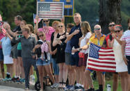 <p>Spectators watch a hearse containing the body of the late Senator John McCain arrive for a private memorial service and burial at the U.S. Naval Academy in Annapolis, Md., Sept. 2, 2018. (Photo: Mary F. Calvert/Reuters) </p>