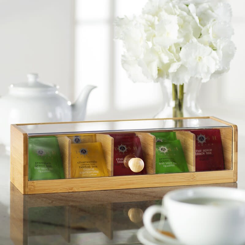 <p><a href="https://go.redirectingat.com?id=74968X1596630&url=https%3A%2F%2Fwww.wayfair.com%2F--%2Fpdp%2Frosalind-wheeler--bamboo-tea-box-x211196954-l1087-w004779052.html&sref=https%3A%2F%2Fwww.housebeautiful.com%2Fshopping%2Fhome-accessories%2Fg45642111%2Fgifts-for-tea-lovers%2F" rel="nofollow noopener" target="_blank" data-ylk="slk:Shop Now;elm:context_link;itc:0;sec:content-canvas" class="link rapid-noclick-resp">Shop Now</a></p><p>Bamboo Tea Box</p><p>wayfair.com</p><p>$21.99</p>