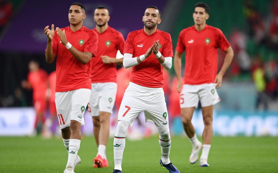 Hakim Ziyech and Morocco players applaud fans during the warm up prior to the FIFA World Cup Qatar 2022 Group F match between Canada and Morocco at Al Thumama Stadium - Michael Regan/Getty Images