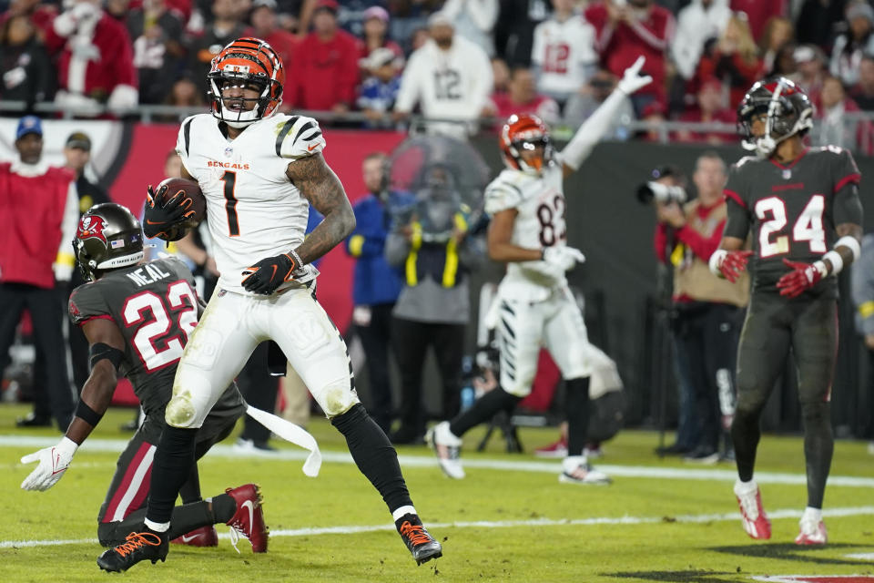 Cincinnati Bengals wide receiver Ja'Marr Chase (1) scores a touchdown against the Tampa Bay Buccaneers during the second half of an NFL football game, Sunday, Dec. 18, 2022, in Tampa, Fla. (AP Photo/Chris O'Meara)