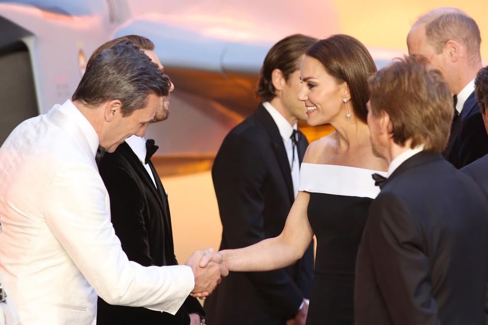 Catherine, Duchess of Cambridge shakes hands with Jon Hamm as she attends the Royal Film Performance and UK Premiere of "Top Gun: Maverick" at Leicester Square on May 19, 2022 in London, England.