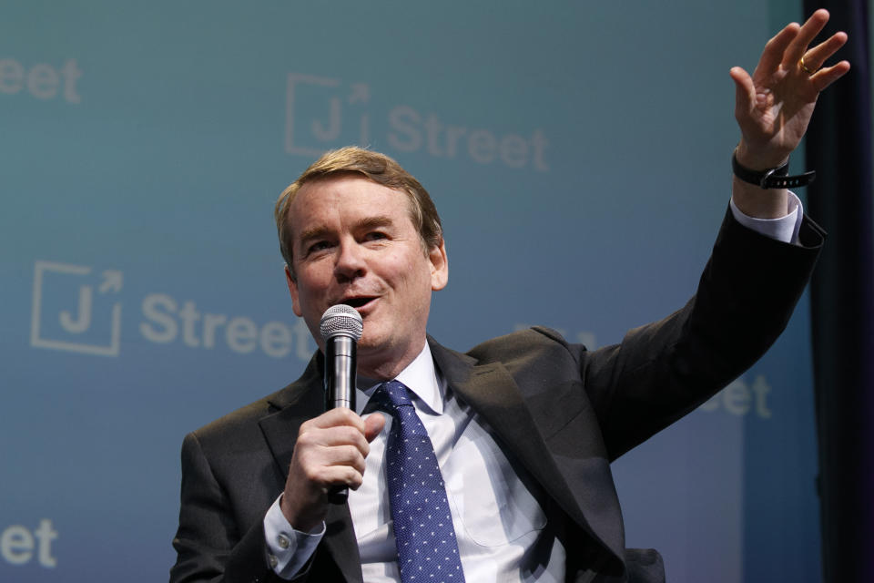 Democratic presidential candidate Sen. Michael Bennet, D-Colo., speaks at the J Street National Conference, with the hosts of "Pod Save the World," Monday, Oct. 28, 2019, in Washington. (AP Photo/Jacquelyn Martin)