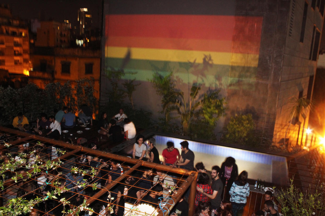 A rooftop party with a rainbow flag projected on the neighboring building during Beirut Pride 2017. (Photo: Hadi Damien)