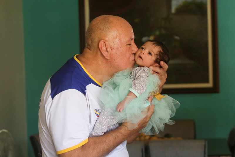 Trade union leader Ruben Gonzalez hugs his granddaughter after being released from prison due to Venezuela's president Nicolas Maduro pardon, in Puerto Ordaz