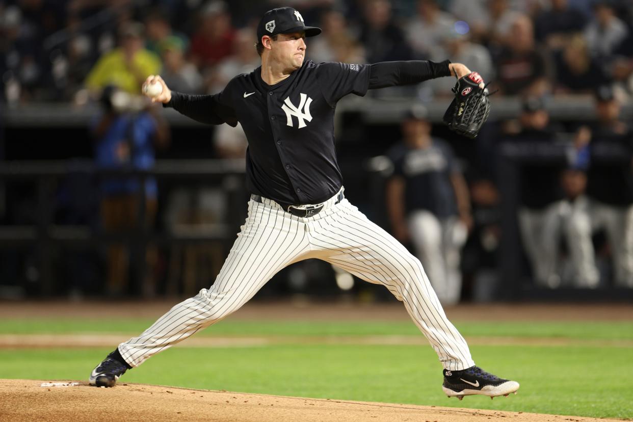 New York Yankees starting pitcher Gerrit Cole throws a pitch against the Toronto Blue Jays during spring training.