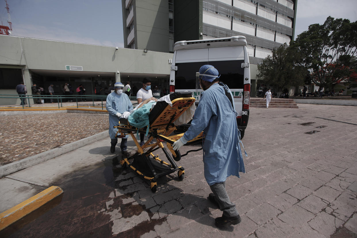 MEXICO CITY, MEXICO - MAY 8: Healthcare workers transfer a patient on the IMSS General Hospital on May 9, 2020 in Mexico City, Mexico. Mexico is on Stage Three of health emergency, as deaths and positive cases grow. According to Health Ministry, Mexico faces the most dangerous week with an exponential spread of contagion. While only essential activities are permitted, government suggests population to stay at home but quarantine is not obligatory as there is major concern about the economic activity. Social distancing measures could be over between May 18 and 30. (Photo by Cesar Gomez/Jam Media/Getty Images)