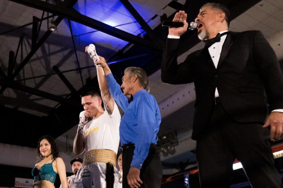 El Paso's Jorge Tovar, black gloves, and Odessa's Emany Rendon compete in the main event of the Throw Down In Chuco Town boxing match at the El Paso County Coliseum on Friday, March 10, 2023.