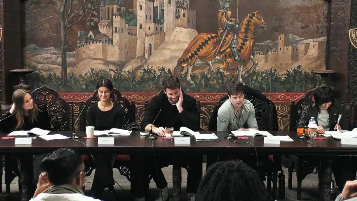 a group of people sitting at a table