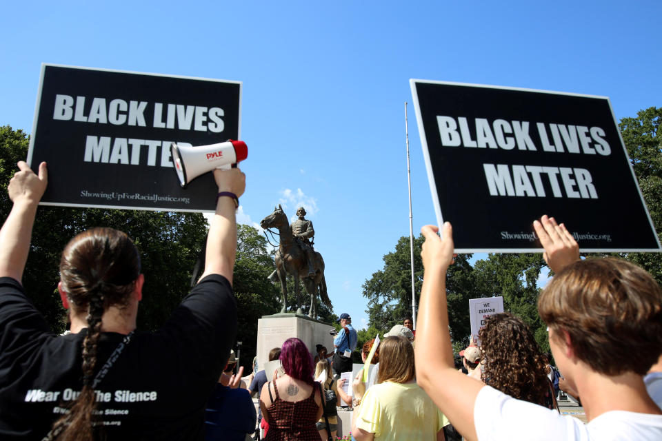 <p>Memphis Coalition of Concerned Citizens hold a rally where the statue of Confederate general and early member of the Ku Klux Klan (KKK), Nathan Bedford Forrest, stands over his grave in Health Sciences Park in Memphis, Tenn., Aug. 19, 2017. (Photo: Karen Pulfer Focht/Reuters) </p>