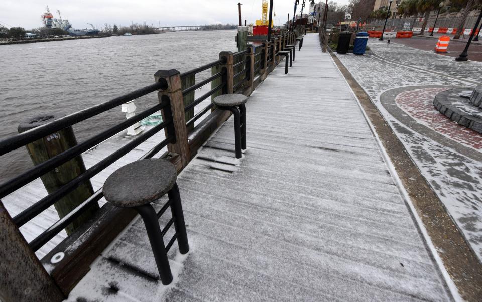 The Riverwalk was covered in ice in Wilmington, N.C., Saturday Jan. 22, 2022. A wintry mix fell throughout the night over the Wilmington area and created dangerous conditions.   [MATT BORN/STARNEWS]