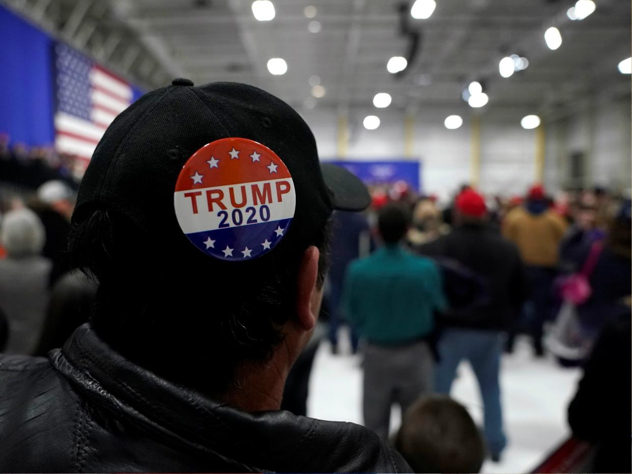 A man wears a Trump 2020 campaign button as US President Donald Trump speaks during a Make America Great Again rally in Pennsylvania, 10 March 2018: REUTERS/Joshua Roberts