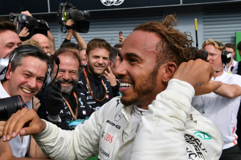 A delighted Lewis Hamilton celebrated with his Mercedes team