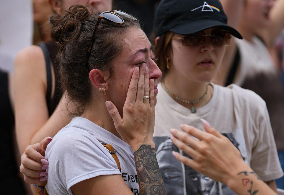 Leigha Cobb cries during an abortion rights rally Saturday, June 25, 2022, at the Indiana Statehouse in Indianapolis. The rally was led by the ACLU of Indiana following the Supreme Court's decision to overturn Roe v. Wade, ending the constitutional right to an abortion. 