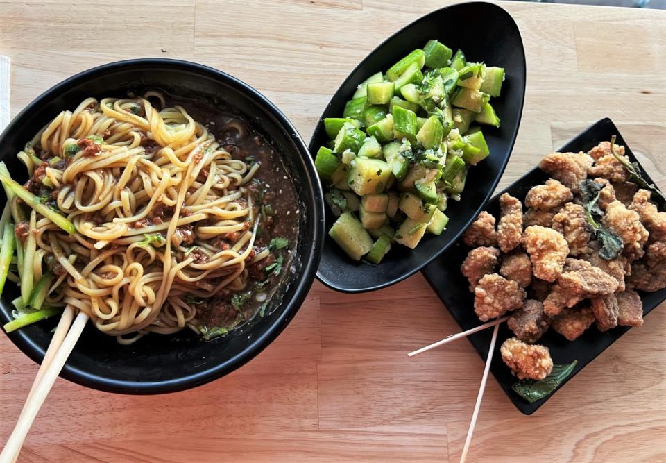 Dishes from Formosa Street Food and Bar in Oklahoma City's Uptown district include beef and noodles, pickled cucumber and basil chicken.