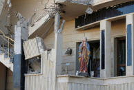 A damaged statue of the Virgin Mary is seen in a church in Qaraqosh, east of Mosul, Iraq November 25, 2016. REUTERS/Goran Tomasevic