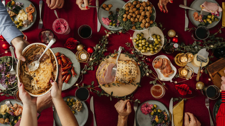 passing dishes at holiday dinner