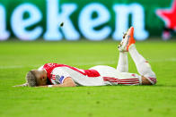 Ziyech is left deflated in the turf as the referee blows for full-time.