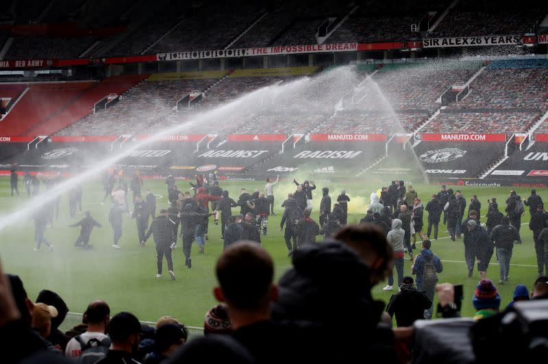 Manchester United fans protest against their owners before the Manchester United v Liverpool Premier League match