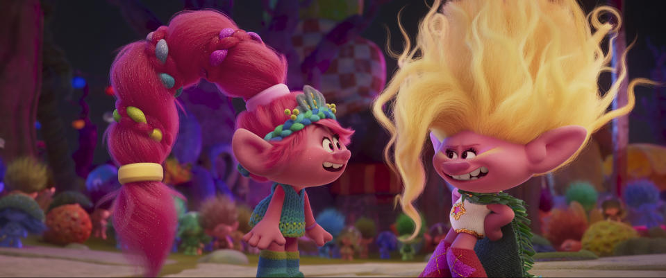 This image released by DreamWorks Animation shows the characters Queen Poppy voiced by Anna Kendrick, left, and Viva voiced by Camila Cabello, in a scene of the animated film “Trolls Band Together.” (DreamWorks Animation via AP)