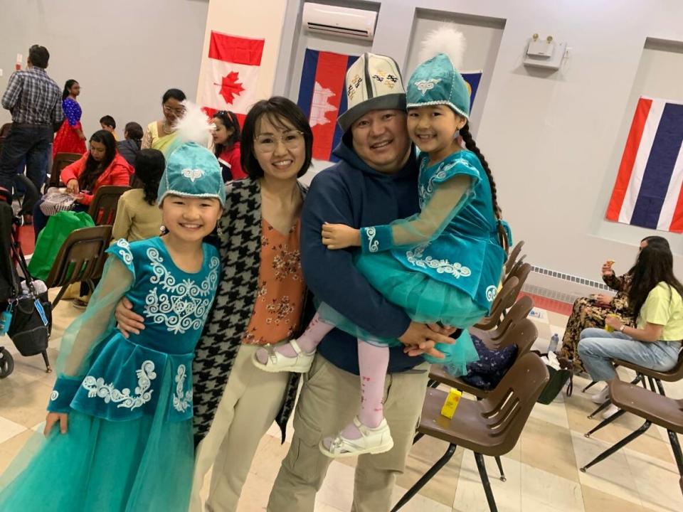 Nazira Tolobek, husband Akberdi Itibaev and daughters Sumaiia and Liliia Beishenbaev during Asian Heritage Month celebrations. (Nipun Tiwari/ CBC News - image credit)