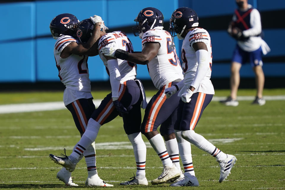 Teammates congratulate Chicago Bears defensive back DeAndre Houston-Carson (36), second from left, following Carson's interception against the Carolina Panthers during the second half of an NFL football game in Charlotte, N.C., Sunday, Oct. 18, 2020. (AP Photo/Brian Blanco)