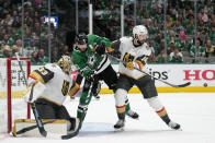 Dallas Stars center Tyler Seguin, center, pressures Vegas Golden Knights goaltender Adin Hill (33) and defenseman Nicolas Hague (14) as a shot go wide of the net in the first period of Game 6 of the NHL hockey Stanley Cup Western Conference finals, Monday, May 29, 2023, in Dallas. (AP Photo/Tony Gutierrez)